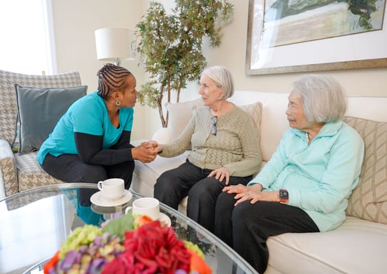 Residents enjoying conversation in a cozy lounge