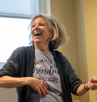 Resident joyfully participating in an activity