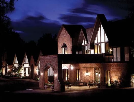 Exterior view of an assisted living facility at night
