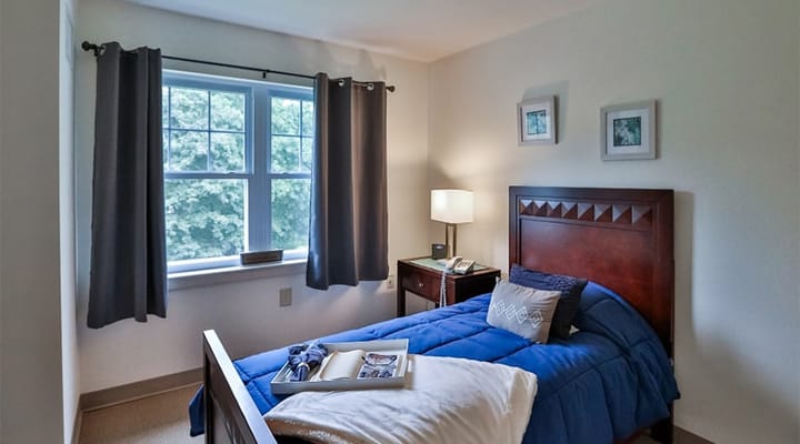 Private resident room with a bed and window