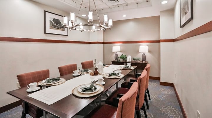 A well-set dining room with elegant decor and table settings