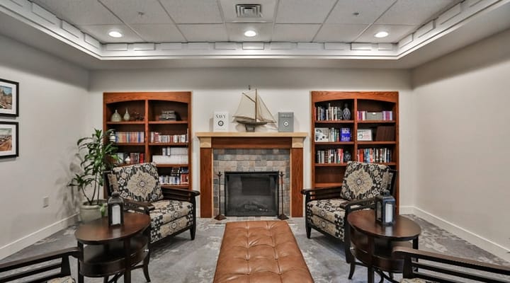 Cozy common area with seating and bookshelves