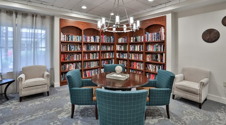 Cozy reading area with bookshelves and seating