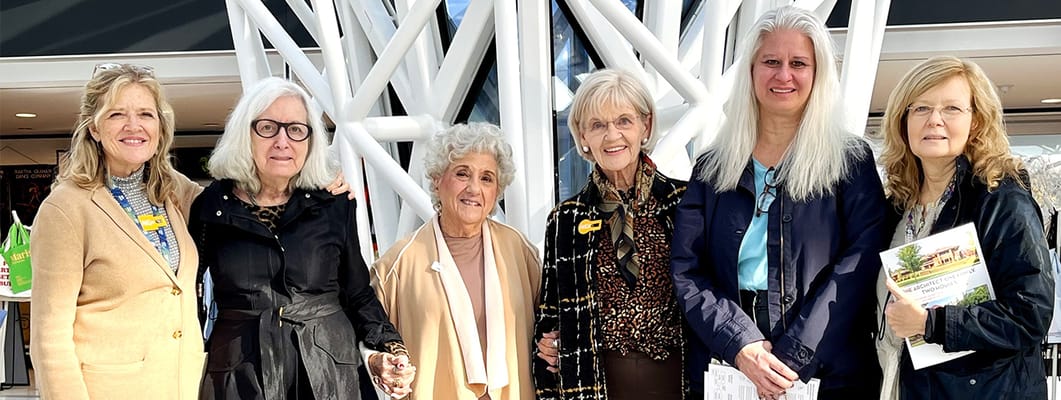 Group of women smiling in a common area