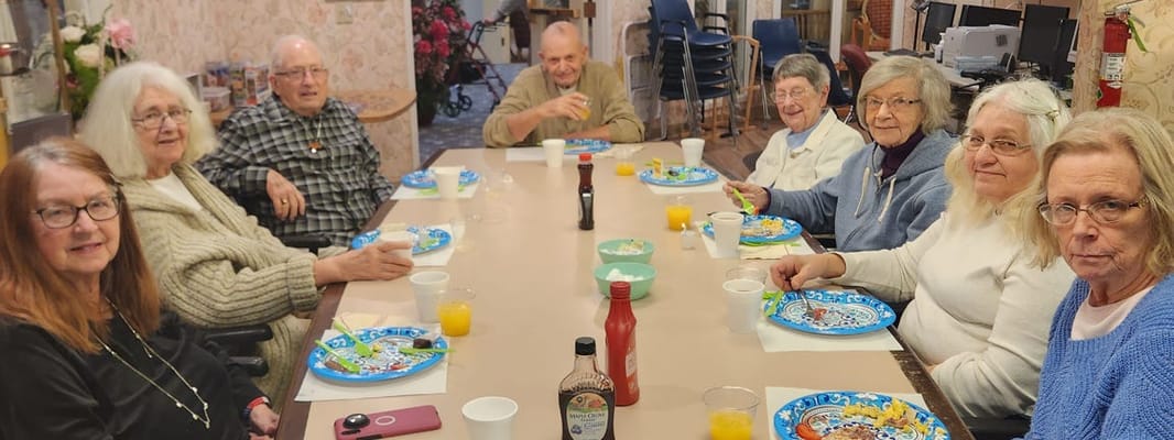 Residents enjoying a meal together in a dining area