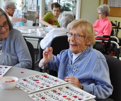 Residents playing bingo in a common area