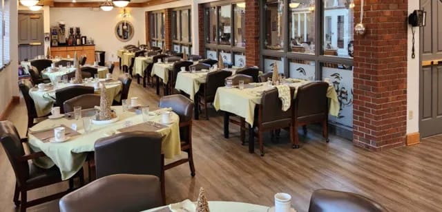 Dining area with tables set for residents