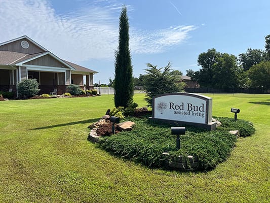 Exterior view of Red Bud Assisted Living facility sign