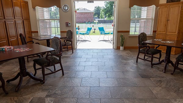 Interior view of a common area with tables and chairs