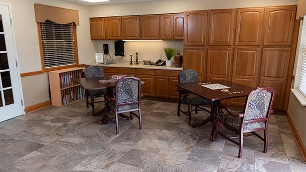 Interior seating area with wooden cabinets and tables