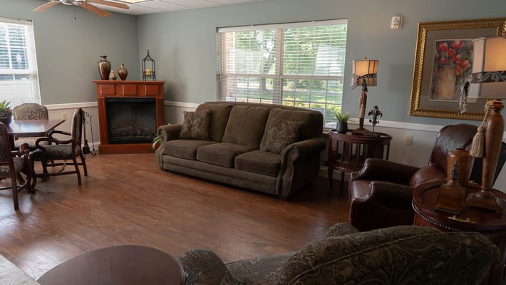 Common area with seating and a fireplace