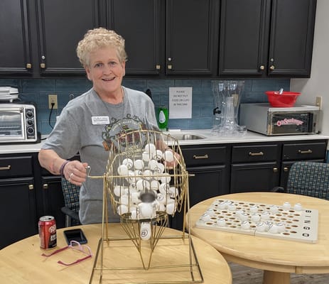 Resident playing bingo in a communal area