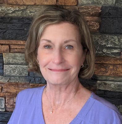 Staff member smiling in a professional setting