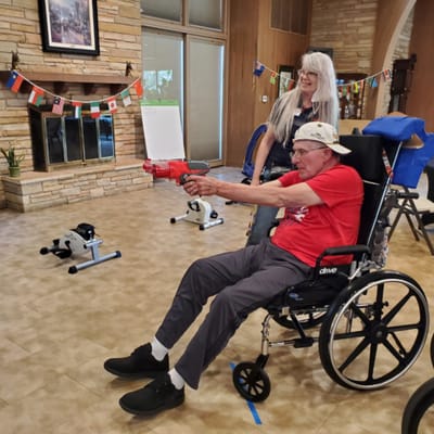 Resident enjoying an activity in a community room