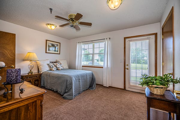 Cozy resident room with a bed and dresser