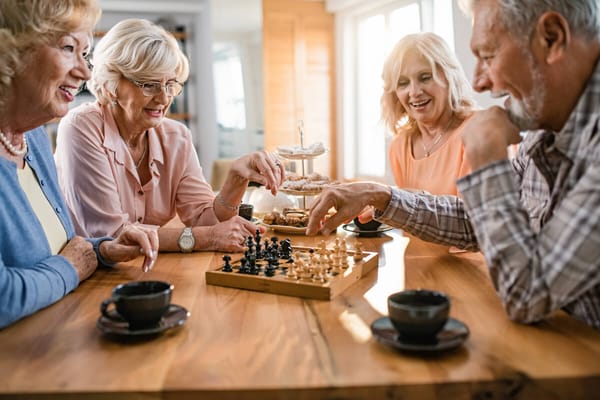 Residents enjoying a game of chess in a social setting