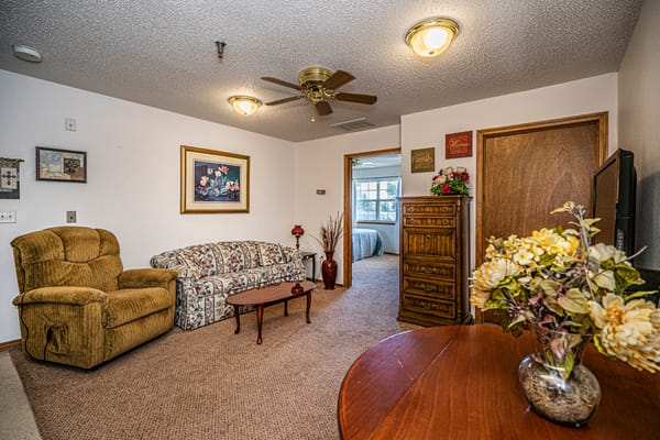 Cozy resident room with seating and decorations
