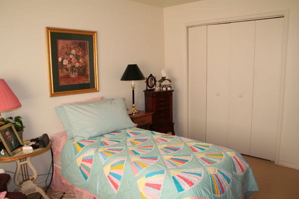 Cozy resident room with bed and decorations