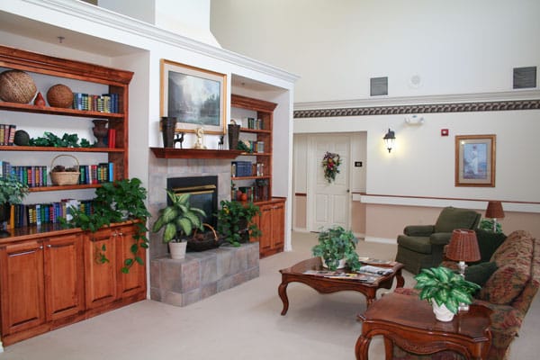 Cozy common area with seating and bookshelves