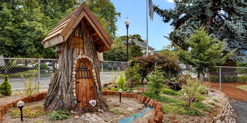 Decorative outdoor garden with tree house structure