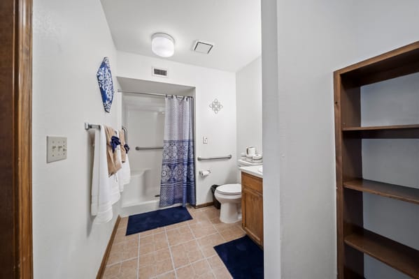 Bright clean private resident bathroom.
