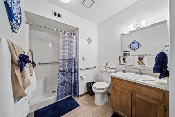 Clean bathroom interior with blue accents and modern fixtures
