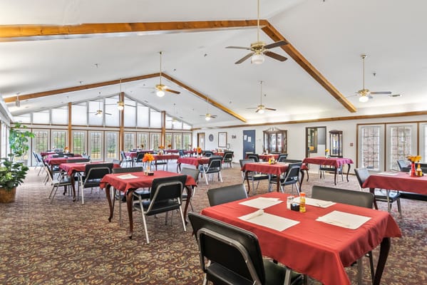 Interior view of a dining room with tables set up