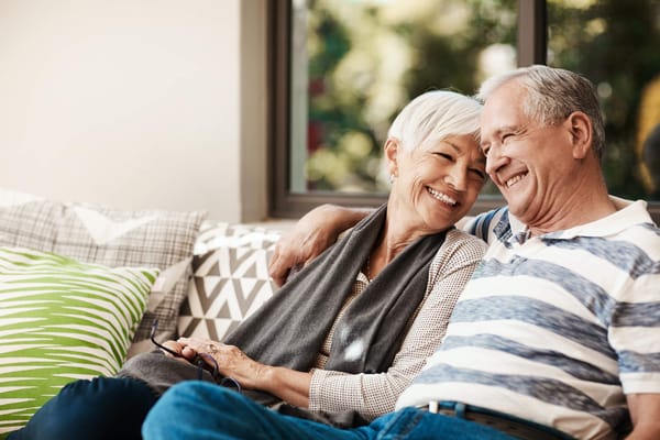Couple enjoying time together indoors, smiling