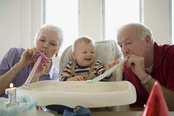 Residents celebrating a birthday with a child