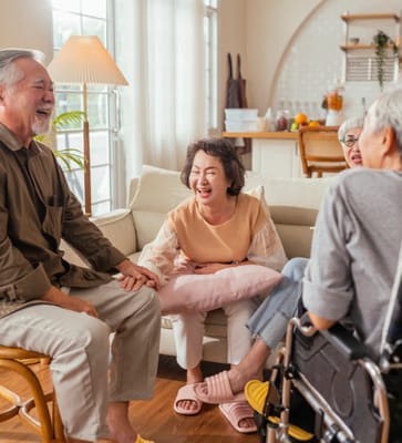 Residents enjoying a lively conversation in a cozy lounge