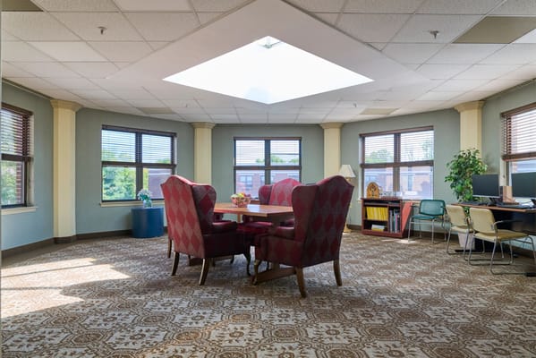 Bright common area with seating and bookshelves