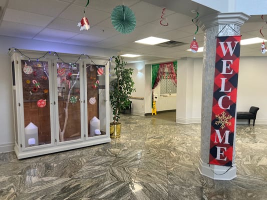 Interior entrance with festive decorations and welcome sign