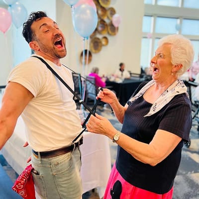 Residents enjoying a lively activity at a celebration