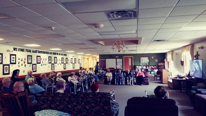 Residents watching a movie in a common area