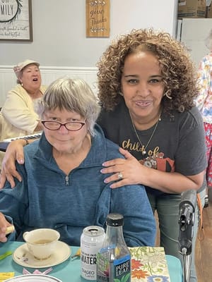 Residents enjoying a group activity with staff