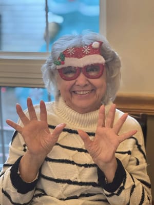 Joyful resident celebrating with festive glasses