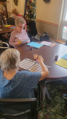 Residents playing bingo in an activity room