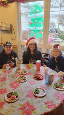 Residents enjoying holiday treats during an activity