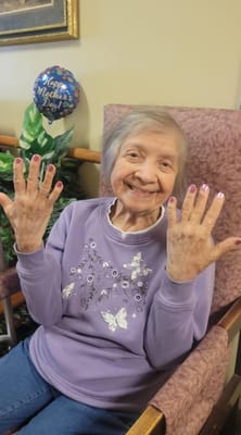 Resident celebrating Mother's Day with painted nails
