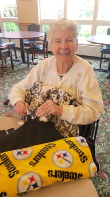 Resident engaging in an activity with a blanket