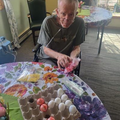 Resident engaged in an activity with decorated eggs