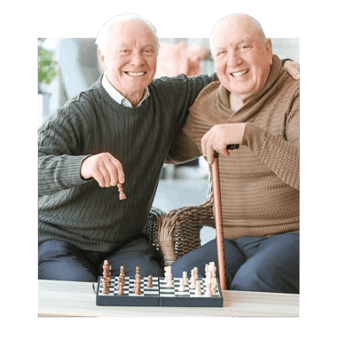 Two elderly men enjoying a game of chess