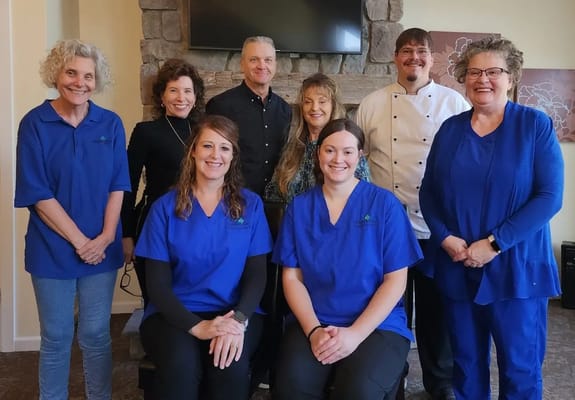 Staff and residents in a common area during a gathering
