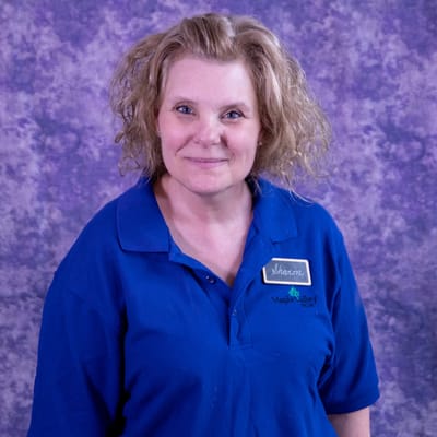 Staff member posing with a friendly smile