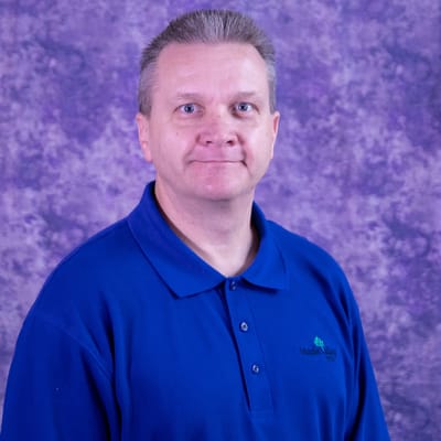 Staff member posing for a photo