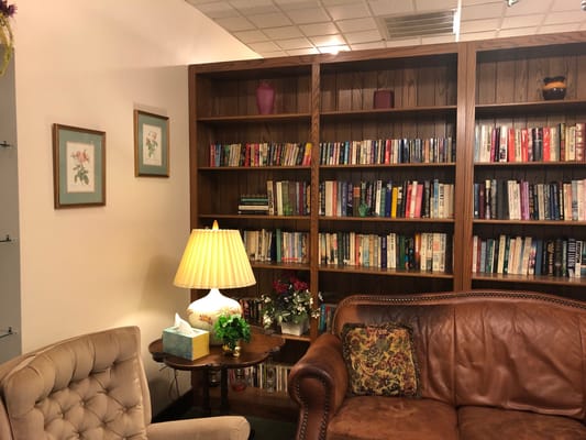 Cozy reading area with books and comfortable seating