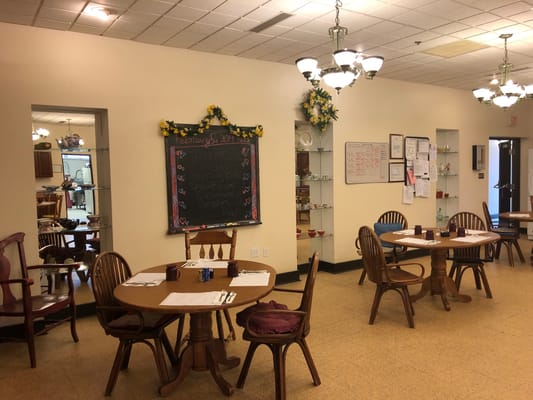 Dining area with tables and a chalkboard menu