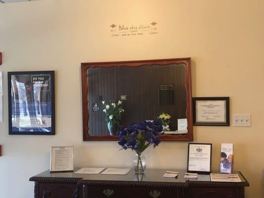 Interior view of a facility lobby with decor and information displays
