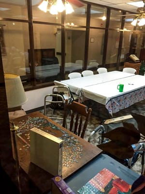 A common area with a jigsaw puzzle on the table