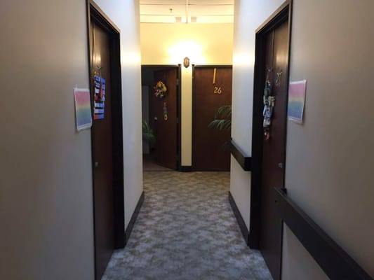 Hallway with resident doors and decorations